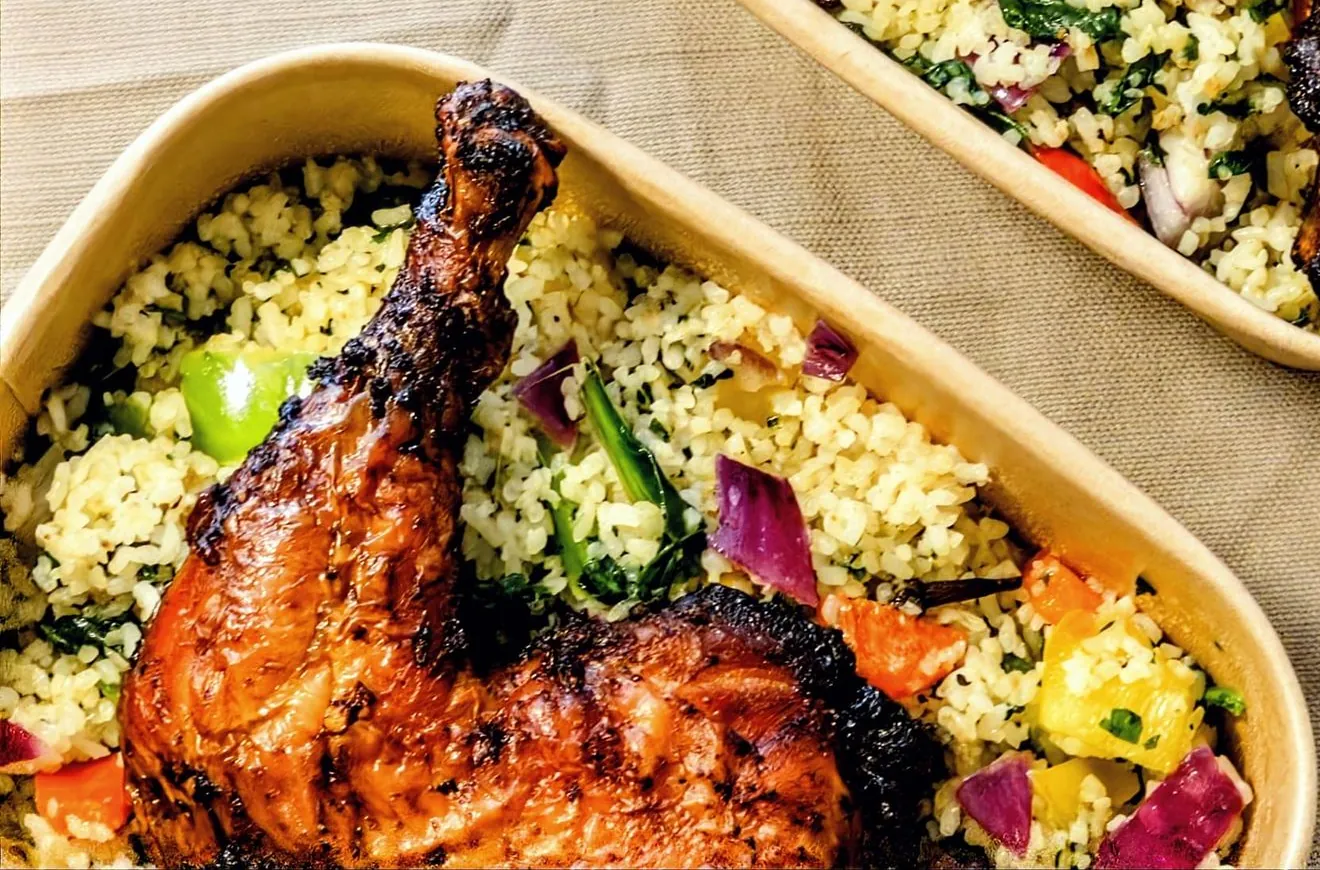 Inside the bowl: grilled chicken on Dambun rice with red onion, peppers and greens